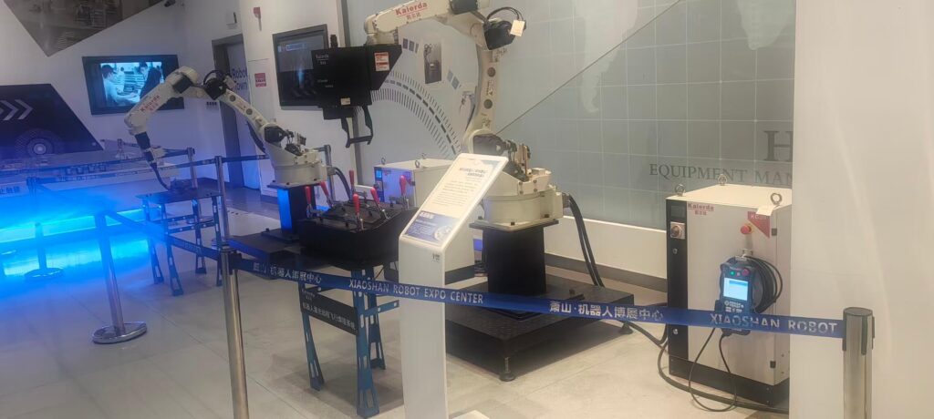 Front view of Kaierda's industrial welding robot, showing its compact arm design and welding torch